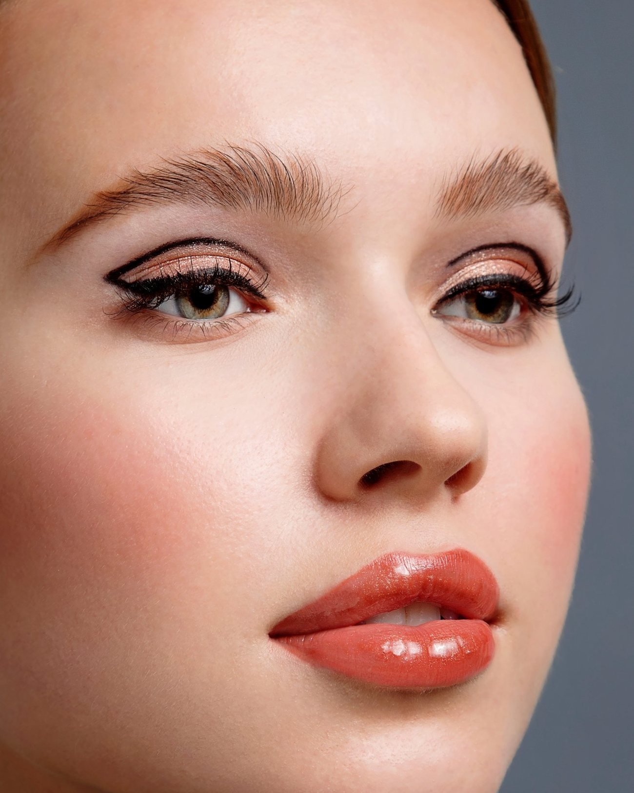 The same portrait after retouching: clean, even, natural skin